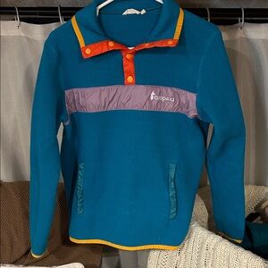 Cotopaxi Teal Pullover with Orange and Purple Accents